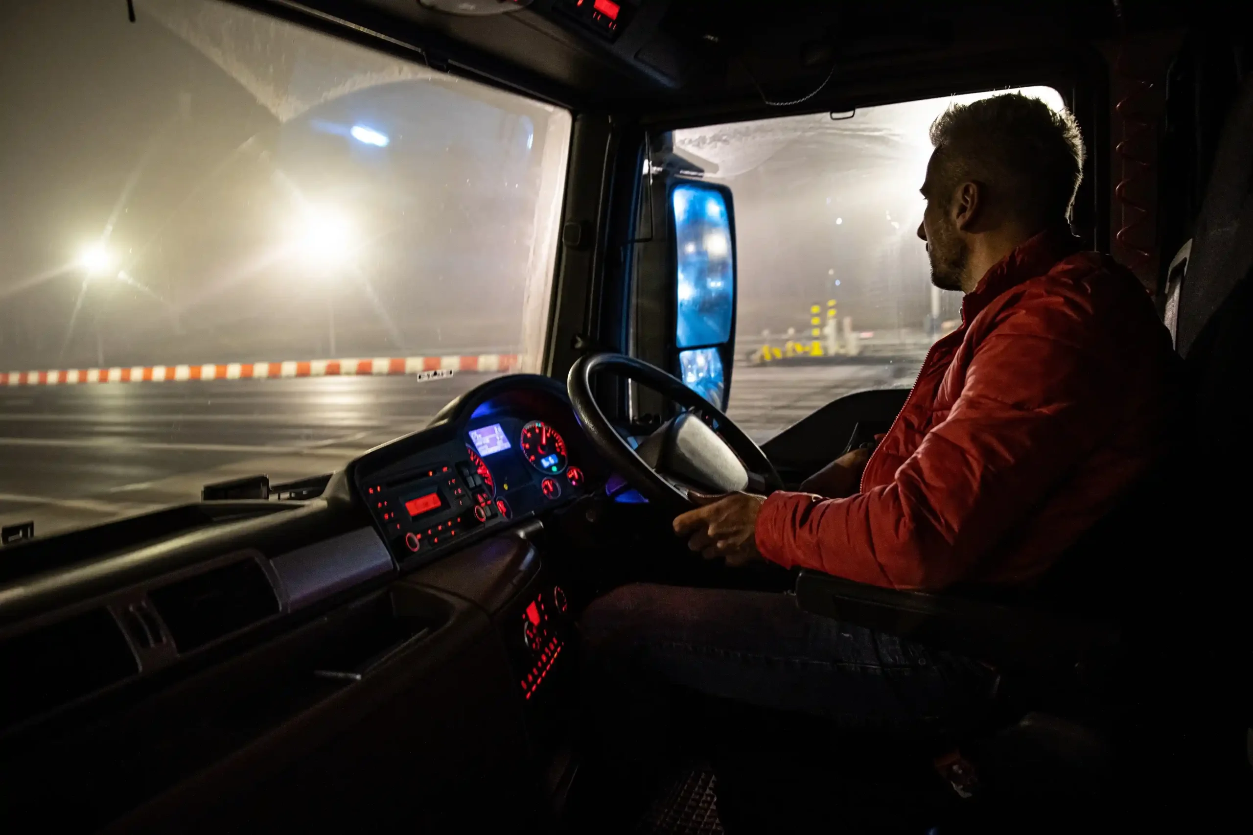 Driver in vehicle at night